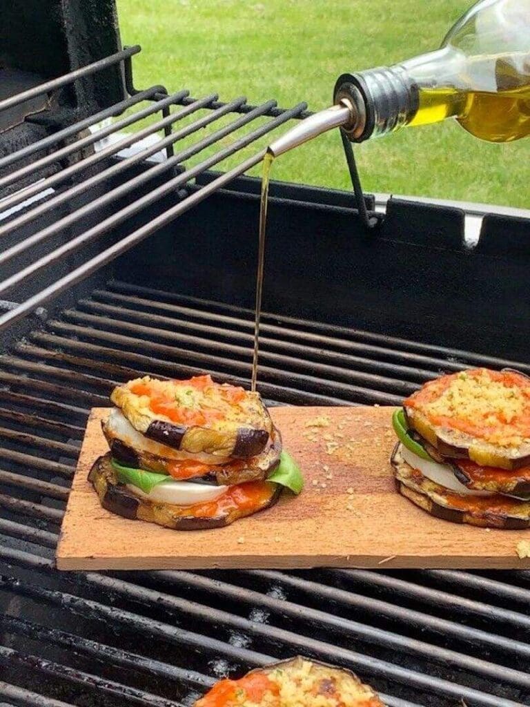A grill with two sandwiches on top of it.