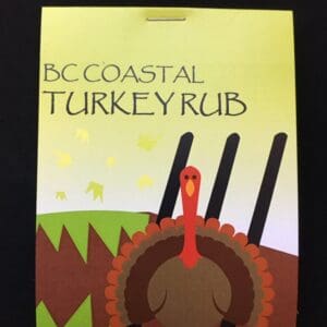 A turkey rub is sitting on the cover of a book.