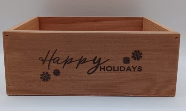 A wooden box with the words " happy holidays ".